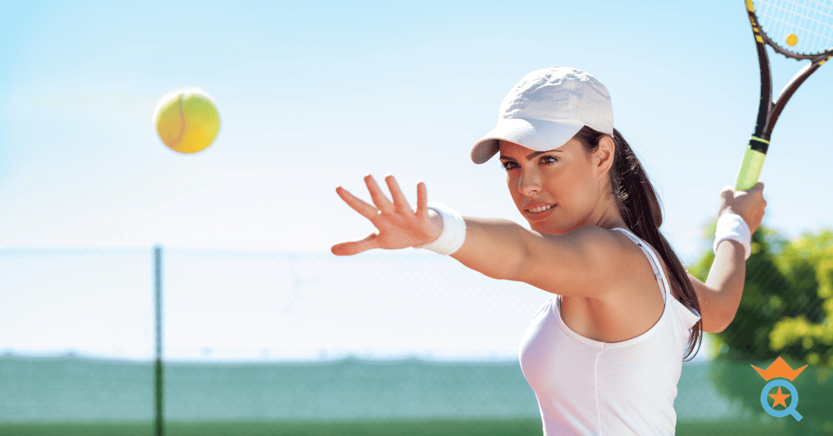 female tennis player getting ready to hit a ball