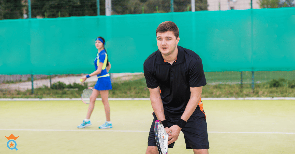 female and male tennis players playing doubles