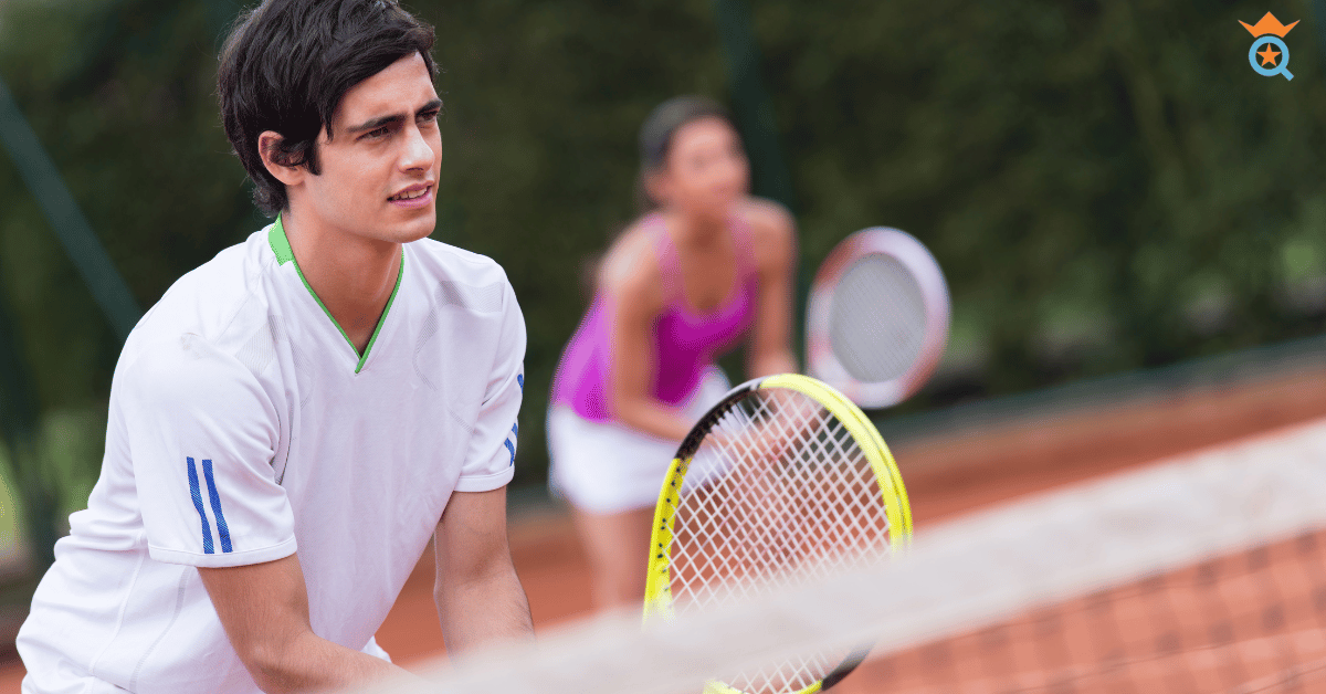 guy playing tennis focusing