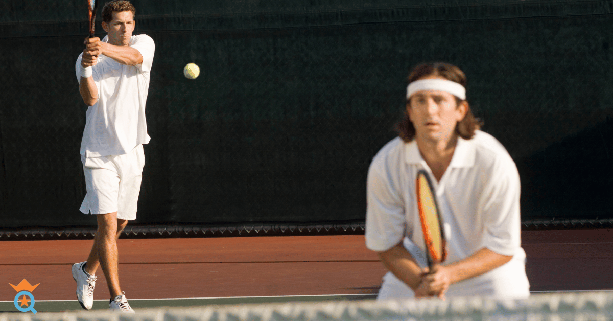 two male athletes playing tennis