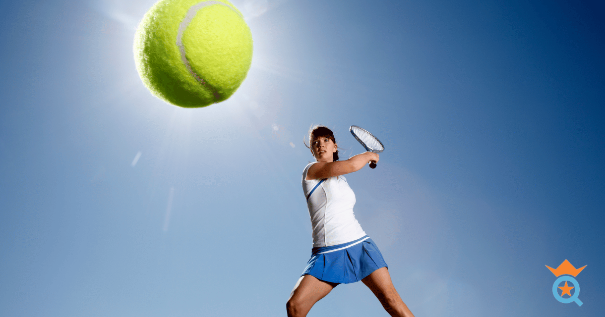 female athlete hitting a tennis ball