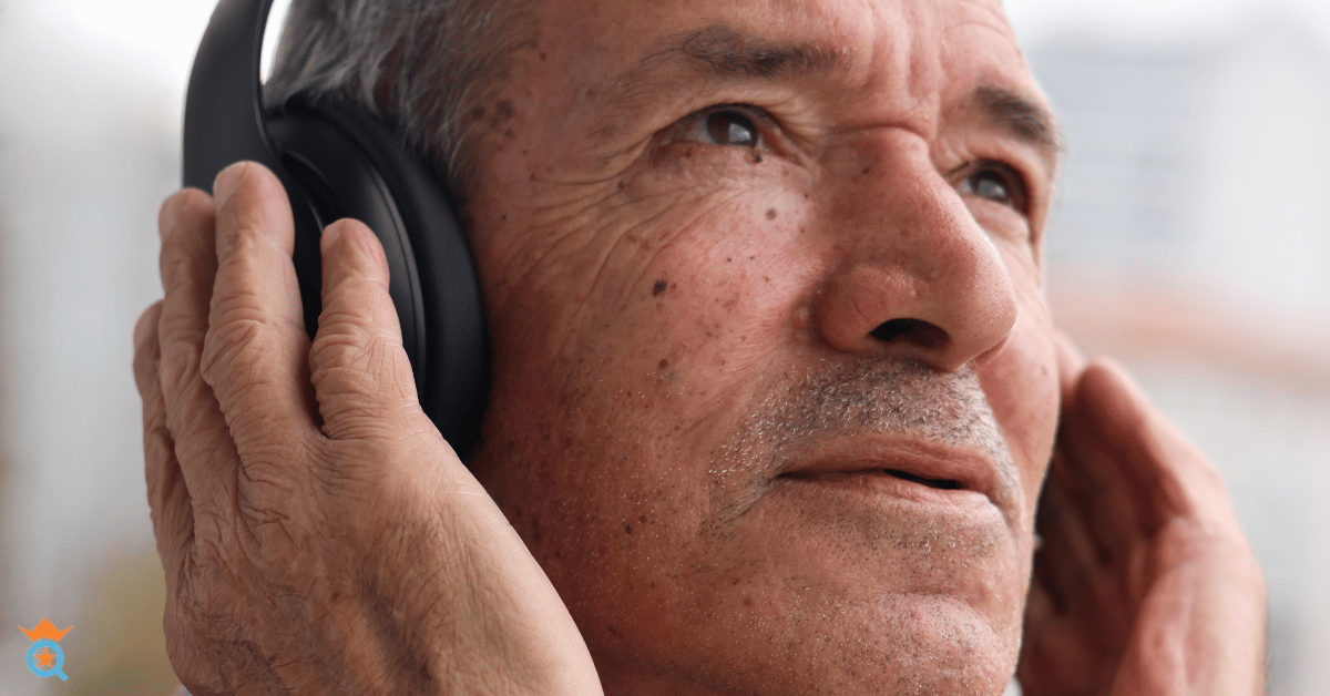middle aged man wearing headphones on