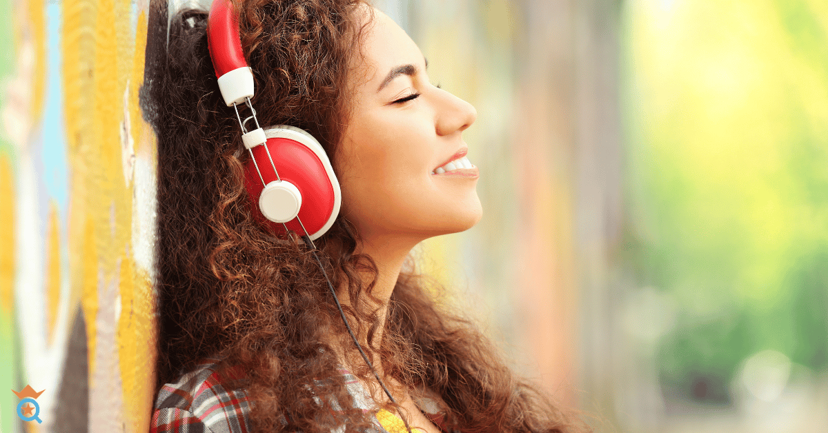 girl with curly hair wearing red headphone